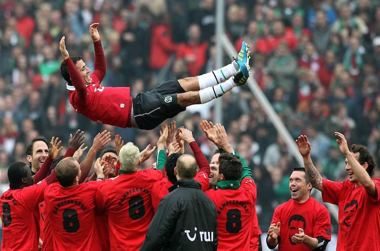 Altin Lala celebrating his retirement from Hannover with his teamater on 5 May 2012.